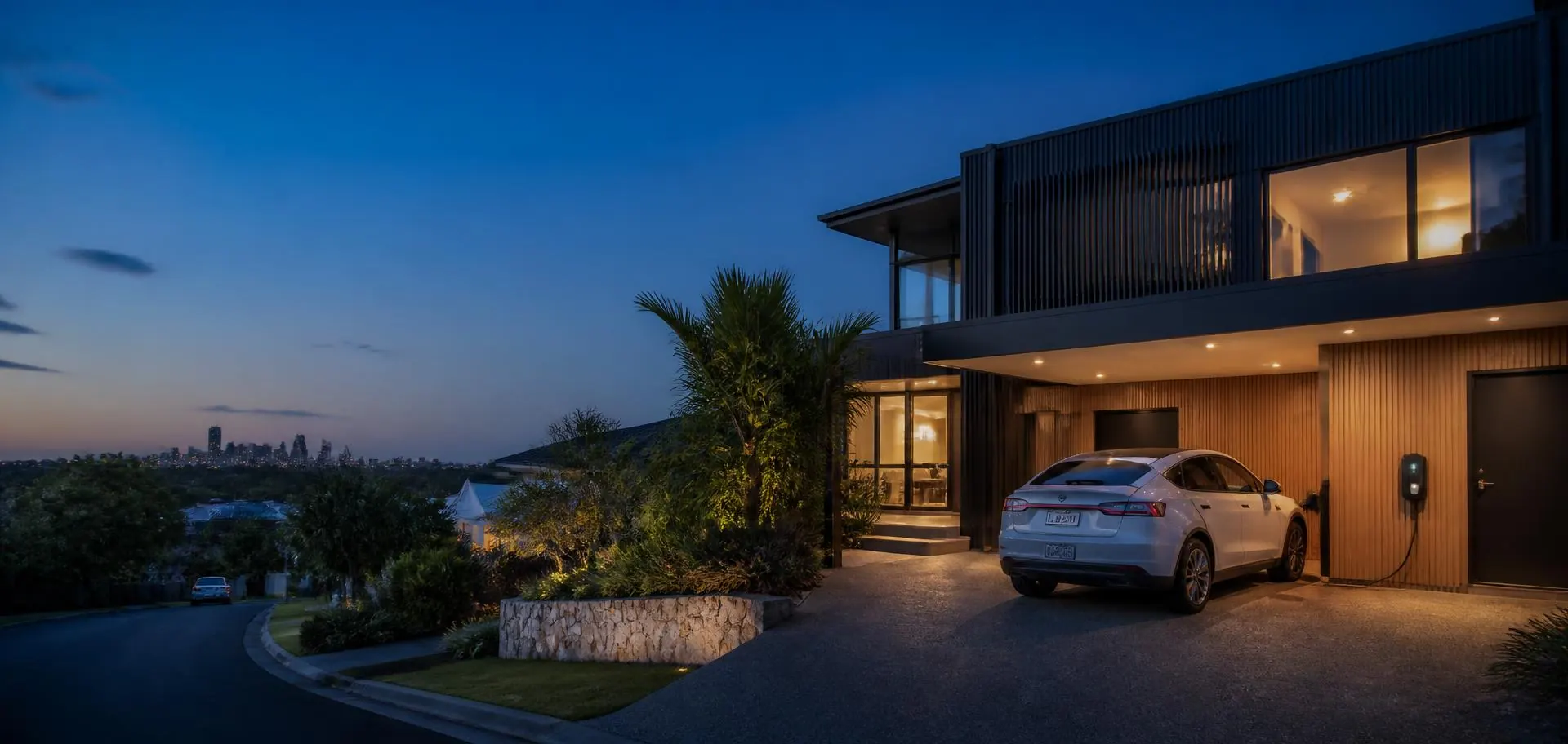 Electric car charging in the driveway of a contemporary Sunshine Coast home at dusk